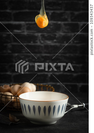 Eggs flying from the sky into a bowl Eggs flying from the sky into a bowl 109343437