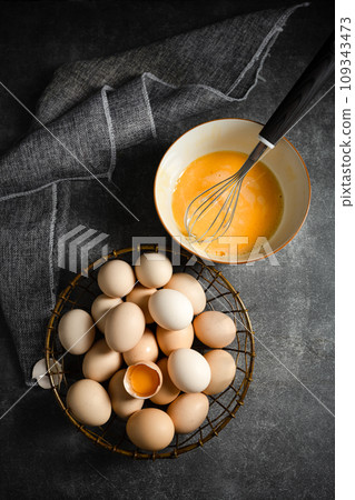eggs in a bowl on a wooden table 109343473