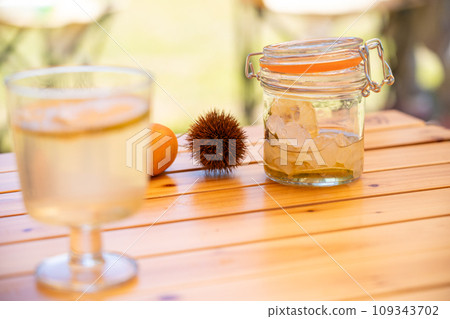 Refreshment Men with honey lemon poured into a stylish glass 109343702