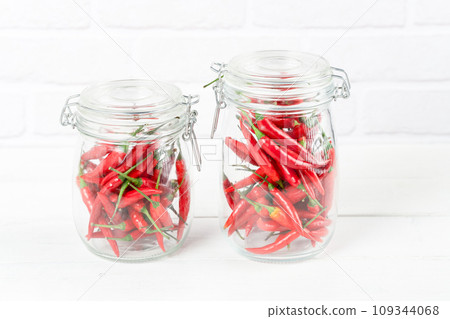 red and dried rose petals in a glass jar red and dried rose petals in a glass jar 109344068