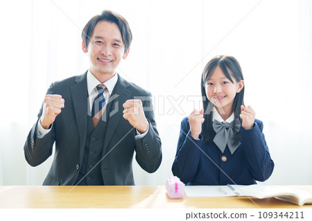 Girl and teacher doing fist pump 109344211