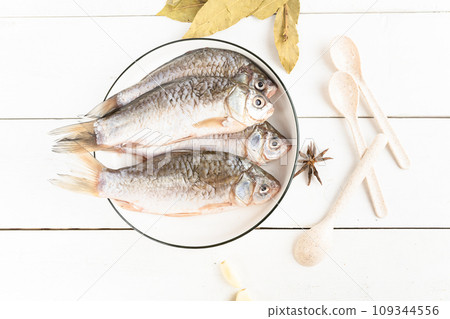 fresh fish with ingredients for cooking fresh fish with ingredients for cooking 109344556