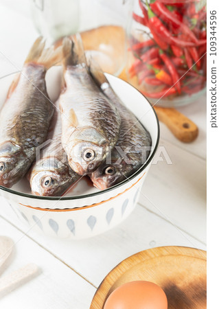 raw fish in a bowl 109344596