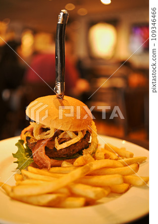 Huge bacon cheeseburger and fries Huge bacon cheeseburger and fries 109346466