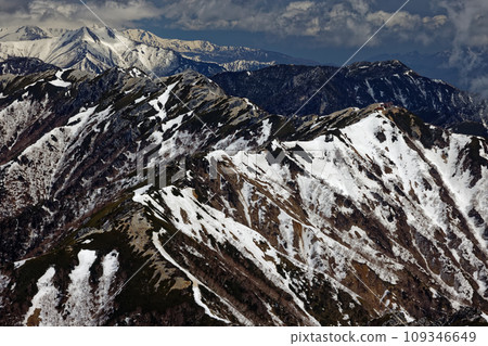Mt. Tsubaku and Mt. Gaki with remaining snow seen from Mt. Otenyo in the Northern Alps 109346649