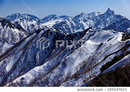 Hotaka Mountain Range, a spear of remaining snow floating in the afternoon light seen from the Tsubakudake ridge in the Northern Alps 109347621