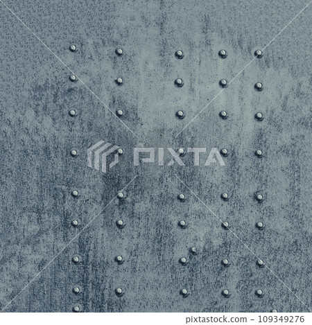 Riveted metal surface, painted grey. Riveted metal surface, painted grey. 109349276