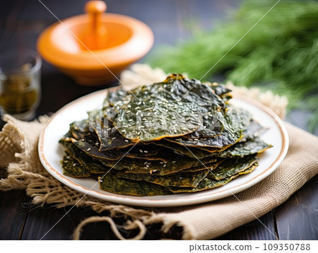 Delicious natural organic seaweed nori snack chips, roasted seasoned crispy sheets of seaweed. Delicious natural organic seaweed nori snack chips, roasted seasoned crispy sheets of seaweed. 109350788