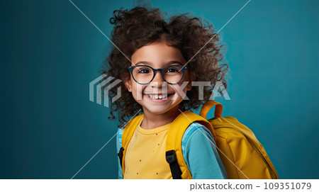 Handsome 7yo little girl in glasses is surprised, inspired, copy space, isolated on blue background Handsome 7yo little girl in glasses is surprised, inspired, copy space, isolated on blue background 109351079