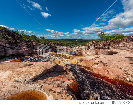 Vast Open Landscape with a River Flowing Through Rocky Terrain Vast Open Landscape with a River Flowing Through Rocky Terrain 109351080