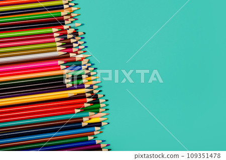 Back to school. Colorful multicolor pencils on blue background. Flatly 109351478