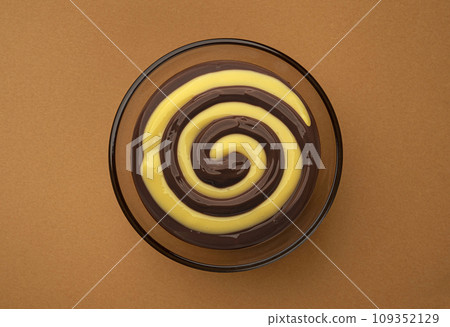 Chocolate and banana cream swirl, top view Chocolate and banana cream swirl, top view 109352129