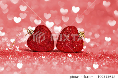 Red glitter heart in front of bokeh pink background. Greeting card for Valentines Day 109353658