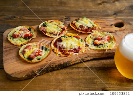 Mini pizza made with gyoza skins Mini pizza made with gyoza skins 109353831