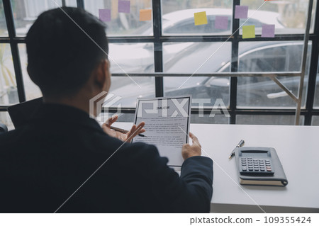 Close up view of job interview in office, focus on resume writing tips, employer reviewing good cv of prepared skilled applicant, recruiter considering application, hr manager making hiring decision Close up view of job interview in office, focus on resume writing tips, employer reviewing good cv of prepared skilled applicant, recruiter considering application, hr manager making hiring decision 109355424