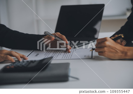 Close up view of job interview in office, focus on resume writing tips, employer reviewing good cv of prepared skilled applicant, recruiter considering application, hr manager making hiring decision Close up view of job interview in office, focus on resume writing tips, employer reviewing good cv of prepared skilled applicant, recruiter considering application, hr manager making hiring decision 109355447