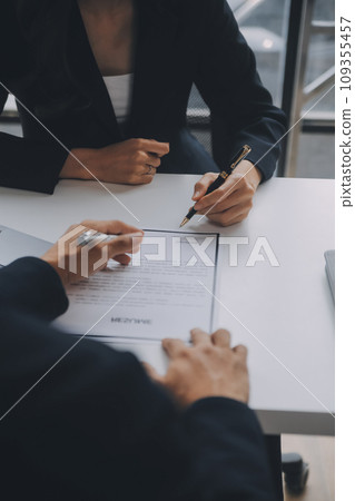 Close up view of job interview in office, focus on resume writing tips, employer reviewing good cv of prepared skilled applicant, recruiter considering application, hr manager making hiring decision Close up view of job interview in office, focus on resume writing tips, employer reviewing good cv of prepared skilled applicant, recruiter considering application, hr manager making hiring decision 109355457