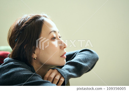 A woman lying on the sofa A woman lying on the sofa 109356005