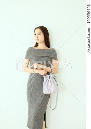 Woman in knit dress Woman in knit dress 109356598