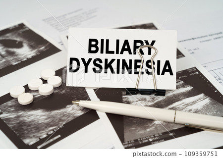 On the ultrasound pictures there is a pen and a business card with the inscription - Biliary dyskinesia 109359751