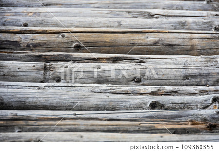 Weathered wood - old logs wooden background 109360355