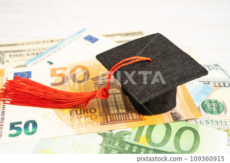 Graduation gap hat on Euro and US dollar banknotes money, Education study fee learning teach concept. 109360915