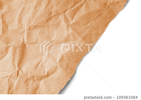 Recycled crumpled orange paper texture with a diagonal torn edge isolated on white background 109361084