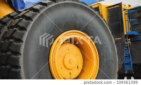A close-up of a wheel of a large truck. Cargo tyre of the world's largest dump truck. 109361399