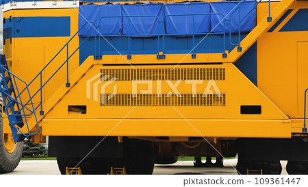 A new quarry dump truck on the territory of the plant. The largest dump truck in the world. Front view. Close-up. Specialized equipment. A new quarry dump truck on the territory of the plant. The largest dump truck in the world. Front view. Close-up. Specialized equipment. 109361447