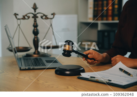 Lawyer, legal advisor, businessman brainstorming information on agreement details Business contracts in legal processing books for accuracy in contract documents. joint financial investment. 109362048
