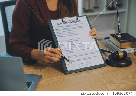 Lawyer, legal advisor, businessman brainstorming information on agreement details Business contracts in legal processing books for accuracy in contract documents. joint financial investment. Lawyer, legal advisor, businessman brainstorming information on agreement details Business contracts in legal processing books for accuracy in contract documents. joint financial investment. 109362074