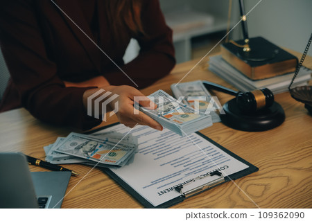 Lawyer, legal advisor, businessman brainstorming information on agreement details Business contracts in legal processing books for accuracy in contract documents. joint financial investment. 109362090