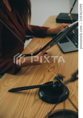 Lawyer, legal advisor, businessman brainstorming information on agreement details Business contracts in legal processing books for accuracy in contract documents. joint financial investment. 109362099