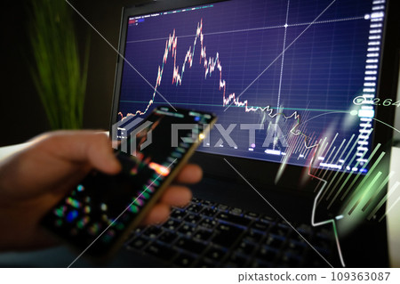 Businessman trading online stock market concept or forex investment exchange. Bitcoins, futures. Crypto currency chart with values moving up and down, trading statistics and analytics on laptop screen Businessman trading online stock market concept or forex investment exchange. Bitcoins, futures. Crypto currency chart with values moving up and down, trading statistics and analytics on laptop screen 109363087