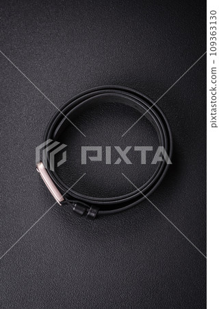 New leather men's belt with an old-style metal buckle New leather men's belt with an old-style metal buckle 109363130