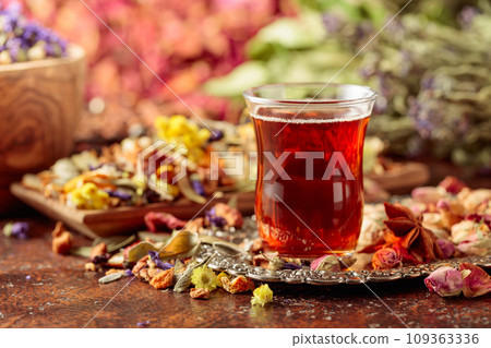 Herbal tea and a mix of various dried medicinal plants and herbs. 109363336