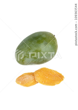 Two pieces of dried mango and a whole mango fruit on a white background. Two pieces of dried mango and a whole mango fruit on a white background. 109363544