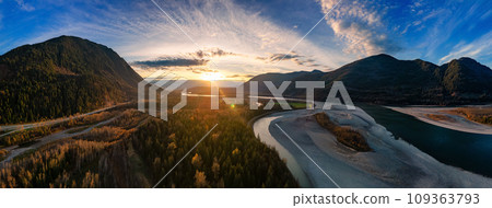 Scenic River in the Valley, surrounded by Mountains. Sunset. Aerial Landscape. 109363793