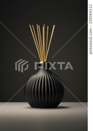 Black diffuser, air freshener and aromatherapy with reed sticks in modern dark background. Concept - aroma bottle for home, luxury home decor and interior details. 109364312