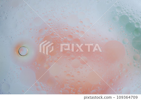 Abstract background in green and orange soft tones. Macro drops of oil 109364709