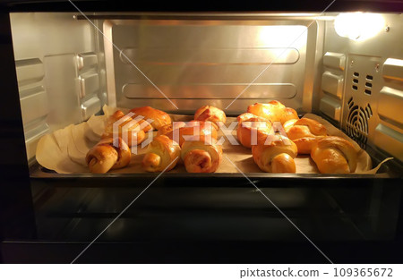Homemade pastry in the oven in cooking process. 109365672