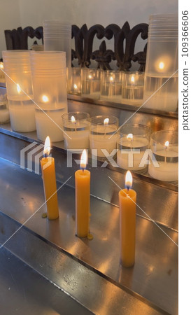 Candles are lit in the Catholic Church. Vertical video for the smartphone. Candles are lit in the Catholic Church. Vertical video for the smartphone. 109366606