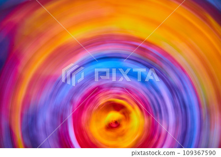 Abstract sunrise with tie dye rainbow swirl of color in artistic blur 109367590