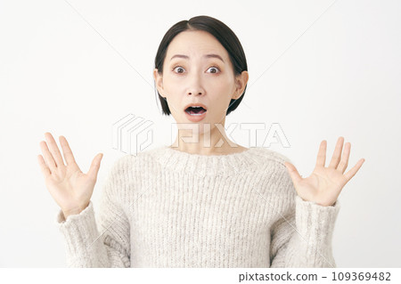 Surprised middle-aged woman white background Surprised middle-aged woman white background 109369482
