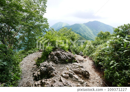 Mount Tanigawa is One of Japanese famous 100 mountains. Mount Tanigawa, Tanigawadake is a craggy, rugged mountain found on the border of Gunma and Niigata prefectures in northern Minakami. Mount Tanigawa is One of Japanese famous 100 mountains. Mount Tanigawa, Tanigawadake is a craggy, rugged mountain found on the border of Gunma and Niigata prefectures in northern Minakami. 109371227