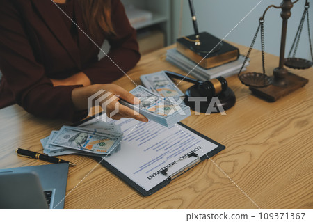Lawyer, legal advisor, businessman brainstorming information on agreement details Business contracts in legal processing books for accuracy in contract documents. joint financial investment. 109371367