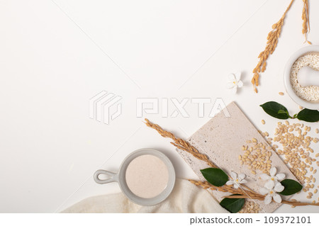 Rice bran and props on white background. Ideal space for displaying products with main ingredients from rice bran. Pure rice bran does not contain lactose, gluten and does not cause allergies. Rice bran and props on white background. Ideal space for displaying products with main ingredients from rice bran. Pure rice bran does not contain lactose, gluten and does not cause allergies. 109372101