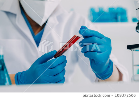 biochemical research scientist team working with microscope for coronavirus vaccine development in pharmaceutical research labolatory, selective focus biochemical research scientist team working with microscope for coronavirus vaccine development in pharmaceutical research labolatory, selective focus 109372506