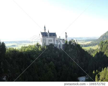 Neuschwanstein Castle is a 19th century historicist palace on a rugged hill above the village of Hohenschwangau near Fussen in southwest Bavaria, Germany. Neuschwanstein Castle is a 19th century historicist palace on a rugged hill above the village of Hohenschwangau near Fussen in southwest Bavaria, Germany. 109372792