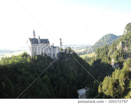 Neuschwanstein Castle is a 19th century historicist palace on a rugged hill above the village of Hohenschwangau near Fussen in southwest Bavaria, Germany. Neuschwanstein Castle is a 19th century historicist palace on a rugged hill above the village of Hohenschwangau near Fussen in southwest Bavaria, Germany. 109372797